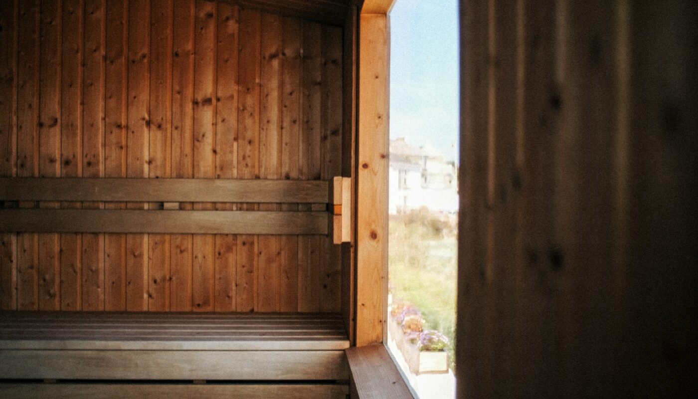 a sauna with wooden walls and a window