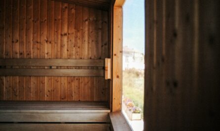 a sauna with wooden walls and a window